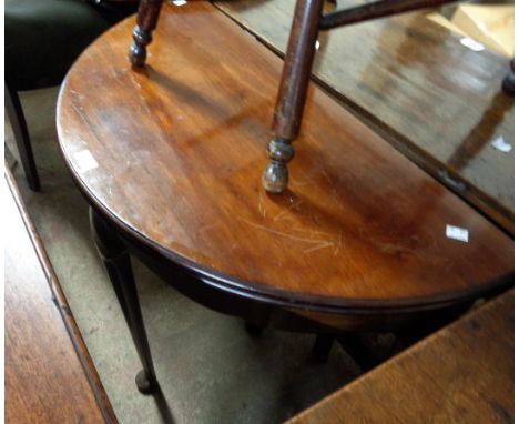 An 82cm 20th Century demi-lune fold-over card table, set on tapered legs with pad feet - for repolishing