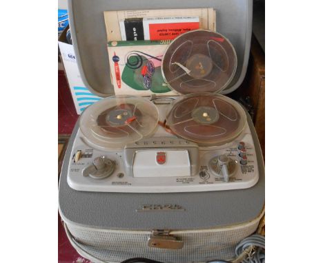 A vintage Grundig TK24 four track reel-to-reel tape recorder - sold with associated booklets, reels and a copy of the Grundig