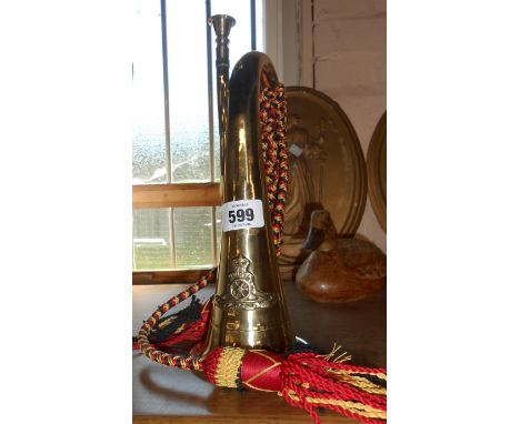 A modern reproduction brass bugle