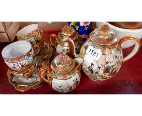 A Japanese eggshell porcelain part tea set comprising teapot, hot water jug, sucrier, four cups and biscuit saucers