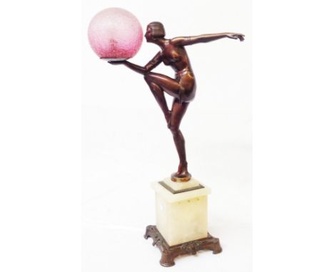 A 1930's Art Deco table lamp in the form of a stylised dancing girl with bronzed finish on an alabaster plinth with bronzed m