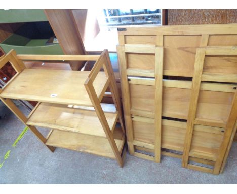 A pair of vintage stained mixed wood three shelf folding bookcases