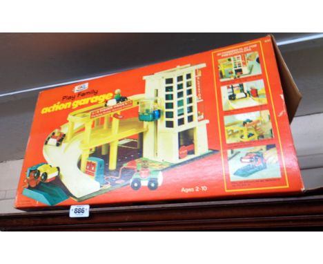 A vintage boxed Fisher Price Play Family action garage