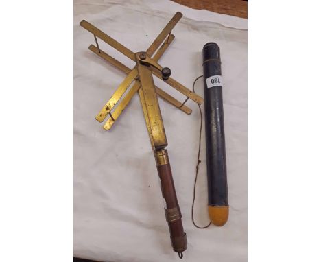 A vintage Army and Navy brass and wood X-frame fishing line winder - sold with a Hardys London Torpedo float