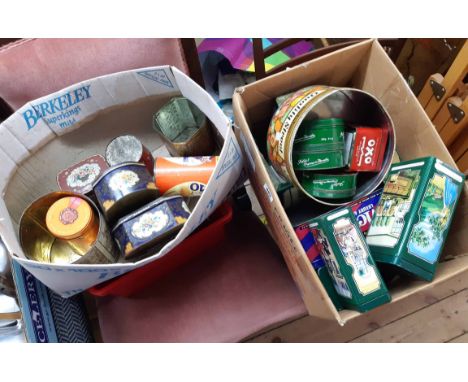 Two boxes of assorted vintage advertising tins