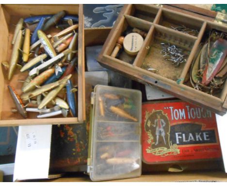 A box containing a collection of vintage fishing lures, spinners and spoons, etc.