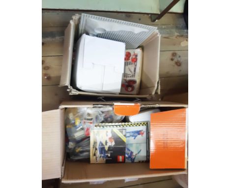 Two boxes containing assorted vintage and later Lego including brochures, stands, bases, boxed motor set, etc.