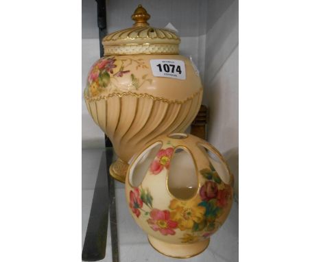 A Royal Worcester blush ivory potpourri vase and covers decorated with hand painted floral sprays - sold with a Royal Worcest