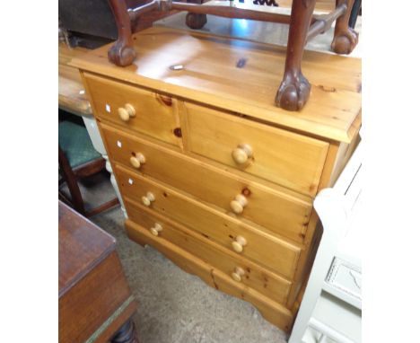 A 90cm modern polished pine chest of two short and three long drawers, set on bracket base