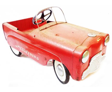 A vintage Triang Lightning child's pedal car with chrome fittings and original red livery and decals
