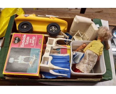 A box containing a large selection of vintage boxed and loose Sindy doll items including Sindy dolls and parts, boxed wardrob