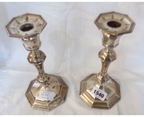 A pair of silver candlesticks with detachable nozzles and loaded octagonal bases by William Hutton &amp; Sons - Sheffield 191