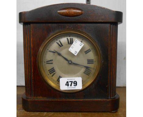 An early 20th Century stained mixed wood cased alarm clock with HAC bell striking movement