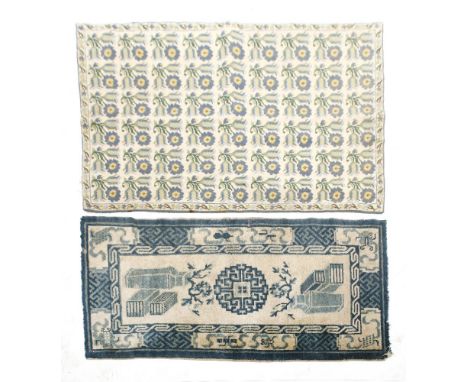 A Greek tapestry rug, 20th century, with a repeating floral motif, bears label 'National Welfare Organisation, Athens',131 x 