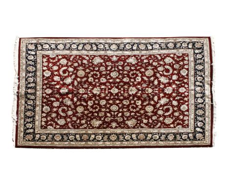 A large modern Indian wine ground carpet, 380cm x 280cm