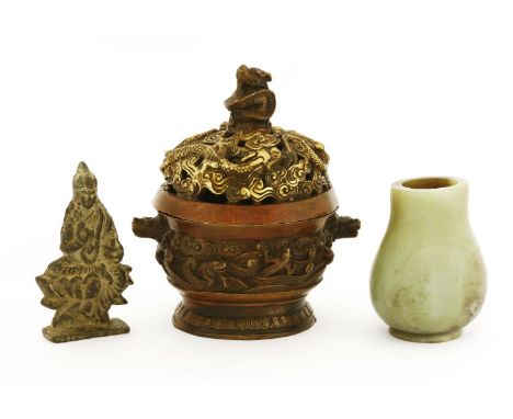 A Chinese bronze incense burner, Republic period (1912-1949), of circular form on a circular foot, the cover pierced and cast