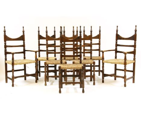 A set of six and two beechwood ladder back dining chairs, with rush seats on stretchered turned supports, 115cm high, and a L