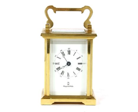 A Mappin and Webb brass cased carriage clock, the white enamel dial with Roman numerals and visual escapement, 10.5cm high