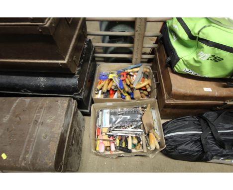 Two boxes containing various tools; to include chisels, files, socket sets, builders trowels, spirit levels etc.