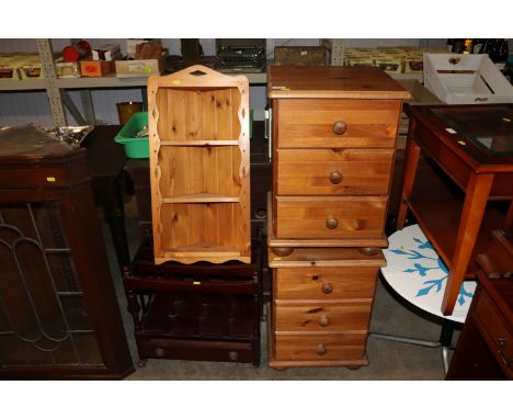 A pair of pine three drawer bedside chests, a pine hanging corner shelf and a mahogany effect canterbury 