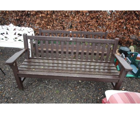 A hardwood slatted garden bench