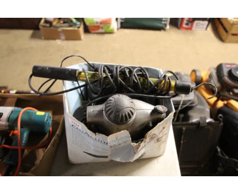 A Parkside hot glue gun; hanging light and a Pro Action steam cleaner