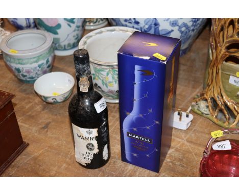 A boxed bottle of Martell Cognac and a Warres 1970's bottle of port