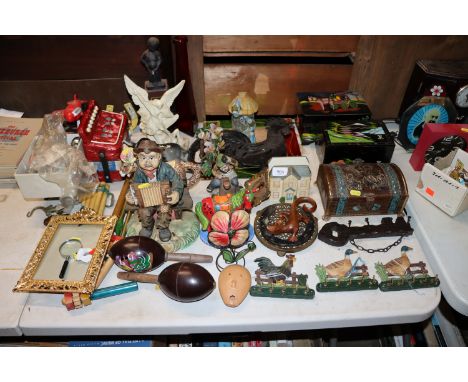 A collection of various decorative trinket boxes; child's accordion, pan style pipes, maracas etc
