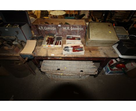 A wooden work bench (measuring approx. 55" x 38"), with fitted bench vice