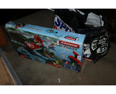 A quantity of Scalextric track and a Mario Kart boxed
