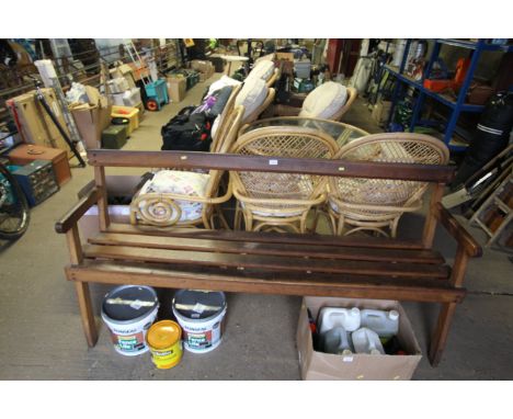 A wooden slatted three seat bench 