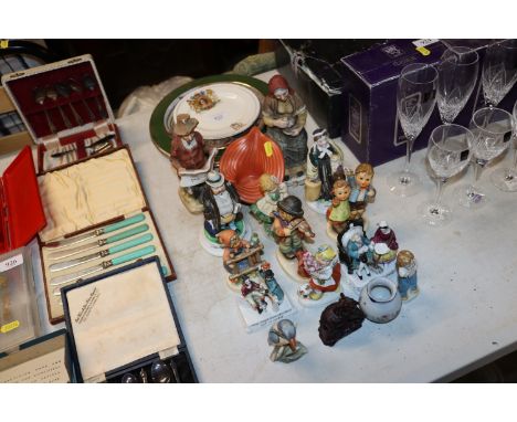 A collection of various Hummel and other figurines, royal commemorative plates etc
