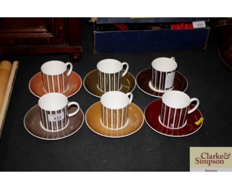 A set of six Susie Cooper coffee cans and saucers
