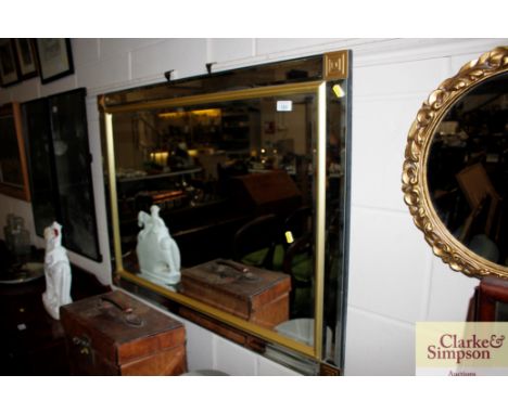 A decorative gilt and bevelled wall mirror 