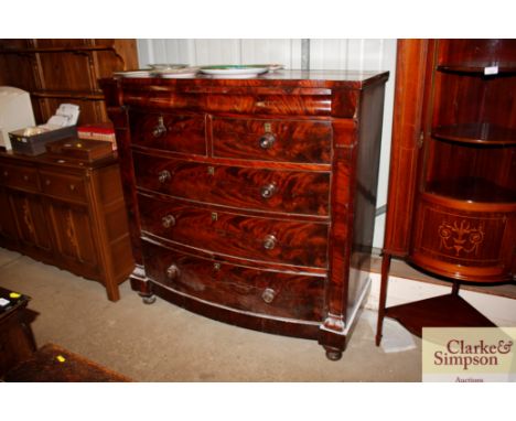 A Victorian mahogany bow fronted chest of two short and tree long drawers 