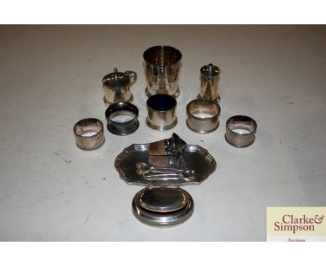 A cruet set; four napkin rings; snuff box; and a telecup