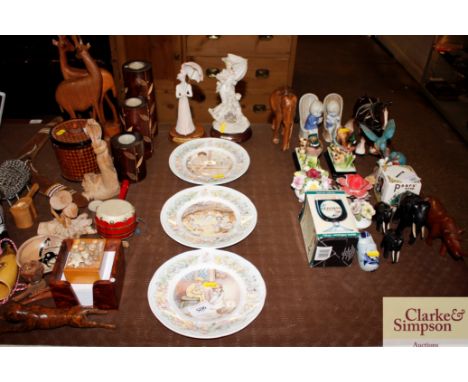 Three Royal Worcester Peter Pan collection nursery plates and a pair of decorative figures