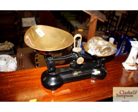 A set of cast iron and brass scales and weights