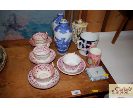 Four Victorian lustre decorated cups and saucers; an Imari pattered twin handled mug; a pair of Japanese vases and a Queen Vi