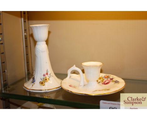 A Royal Worcester chamber stick; and a Royal Worcester candlestick with floral decoration
