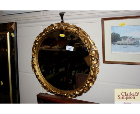 A circular gilt framed wall mirror 