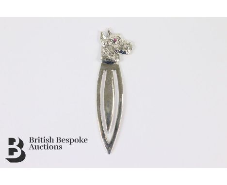 Silver book mark, with a Scotty dog finial, having a ruby eye, approx 5.2 cms in length.&nbsp;
