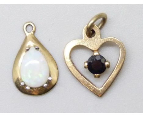 A 9ct gold pendant set with a sapphire, 1.5cm including bale, and a yellow metal opal set pendant, 1.2g total