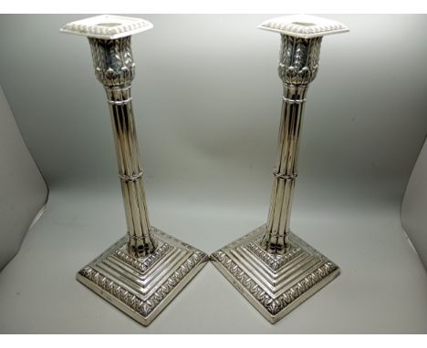 A pair of large silver Corinthian column candlesticks, William Hutton and Sons, London 1914, 27.5cm, weighted bases, 1800g to