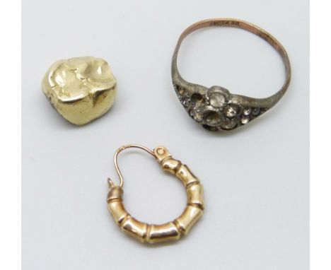 A single 9ct gold hoop earring, a 9ct gold and silver ring, a/f, and a yellow metal tooth cap, 4.1g total