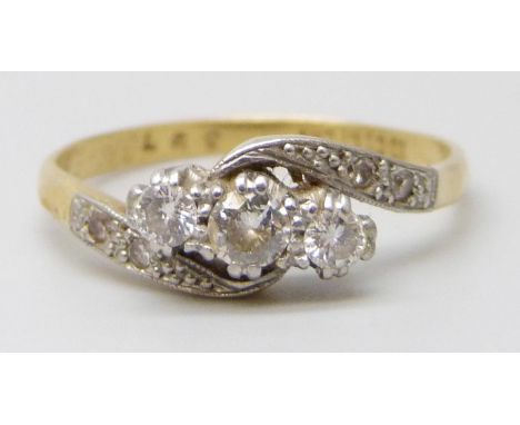 An 18ct gold and platinum set diamond ring, with inscription to inner shank, 2.7g, R