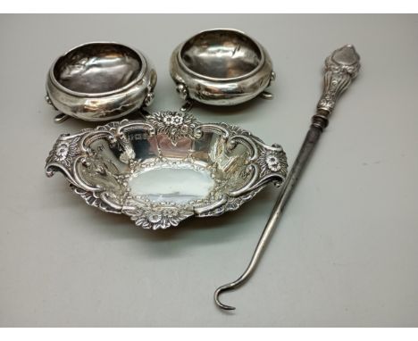 A pair of silver salts, a/f, a silver dish, 43g combined, and a silver handled button hook