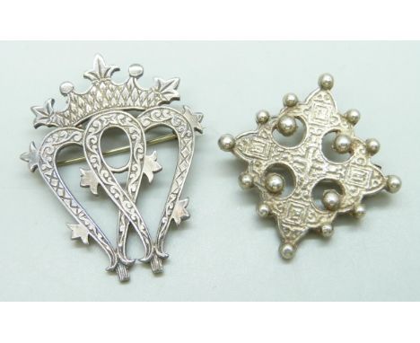 A silver Celtic cross brooch, marked M.S. and a John Hart Iona brooch, 4.4cm, 21g total weight
