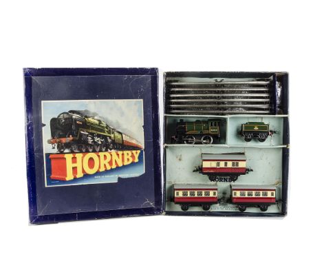 A Hornby 0 Gauge No 51 Passenger Train Set, comprising No 51 BR green clockwork Engine and Tender and three blood and custard