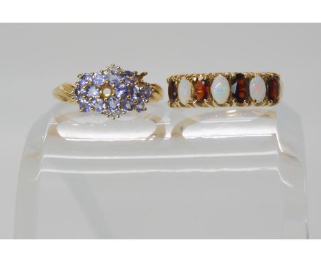 A 9ct gold opal and garnet ring, size O1/2, together with a pale blue gem and diamond ring (af) size O1/2, weight combined 5.